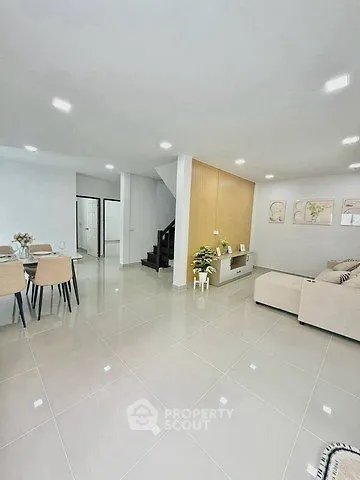 Spacious modern living room with elegant dining area and stylish decor