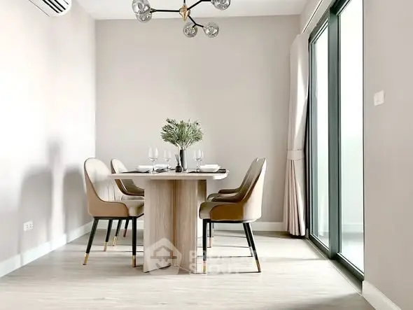 Modern dining area with elegant table and chairs, large windows, and stylish lighting in a bright apartment.