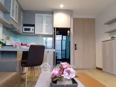 Modern open-layout kitchen with sleek appliances and cozy dining area