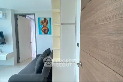 Modern living room with sleek furniture and contemporary art, perfect for urban living.
