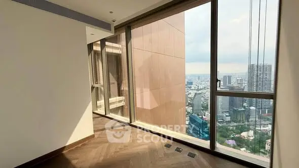 Spacious corner unit with floor-to-ceiling windows offering stunning city views.