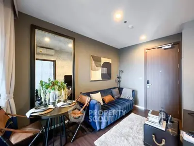 Stylish modern living room with blue sofa and chic decor