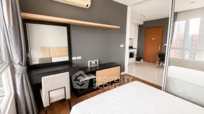 Modern bedroom with sleek furniture and large window in a stylish apartment