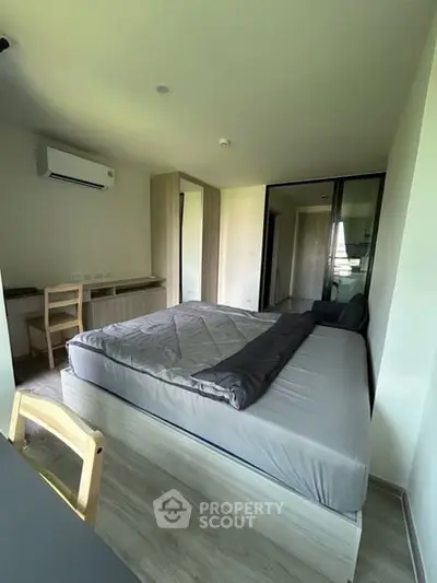 Modern bedroom with sleek design and ample natural light