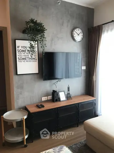 Modern living room with wall-mounted TV and stylish decor