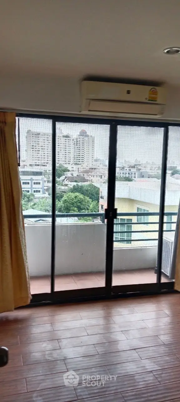 Spacious apartment with balcony offering stunning city views and modern amenities.