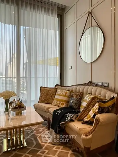 Luxurious living room with elegant sofa and city view through large windows.