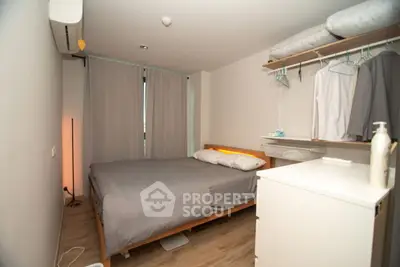 Cozy bedroom with modern decor and ample storage space