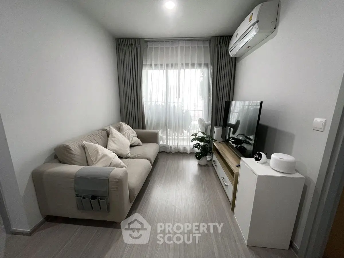 Modern living room with cozy sofa and sleek TV setup