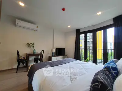 Modern bedroom with balcony and stylish decor in a contemporary apartment