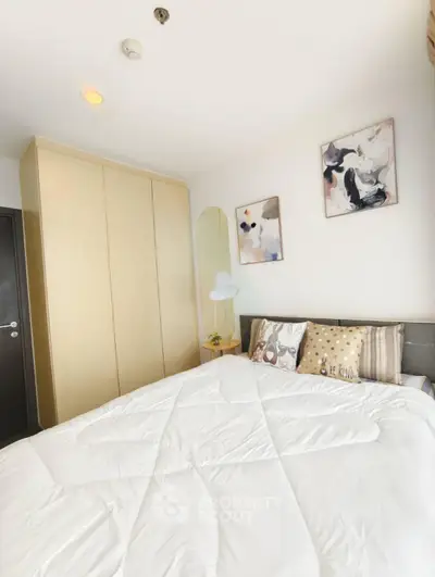Cozy bedroom with modern decor and ample storage space