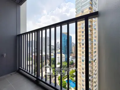 Stunning city view from a modern high-rise balcony, perfect for urban living.