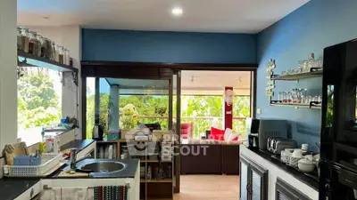 Spacious kitchen with open layout and scenic view, perfect for modern living.