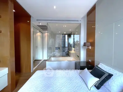 Luxurious bedroom with modern ensuite bathroom and city view, featuring elegant design and high-end finishes.