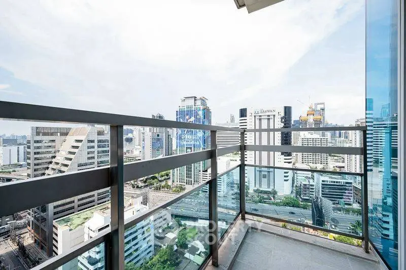 Stunning cityscape view from a modern high-rise balcony, perfect for urban living.