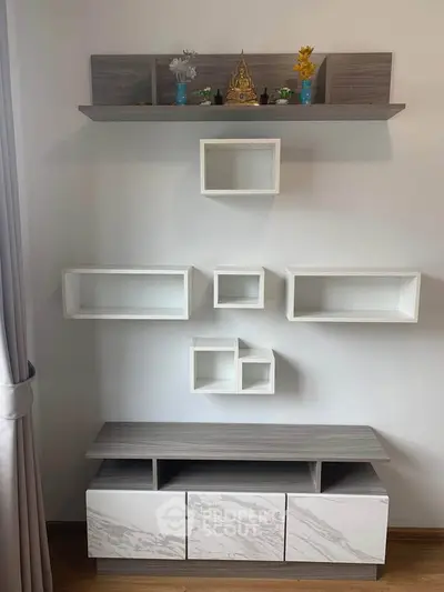 Modern minimalist living room with stylish wall shelves and cabinet
