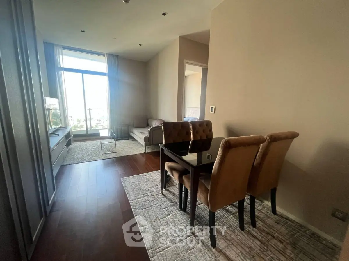 Modern living room with elegant dining area and large window view