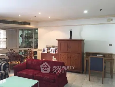 Spacious living room with elegant furniture and ample natural light