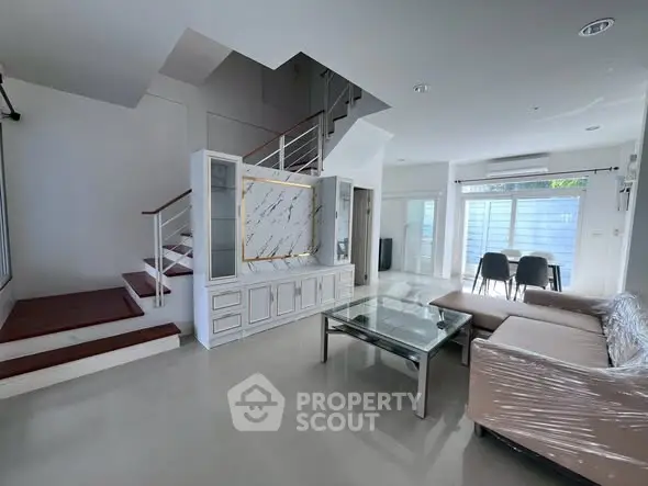 Spacious modern living room with sleek design and natural light