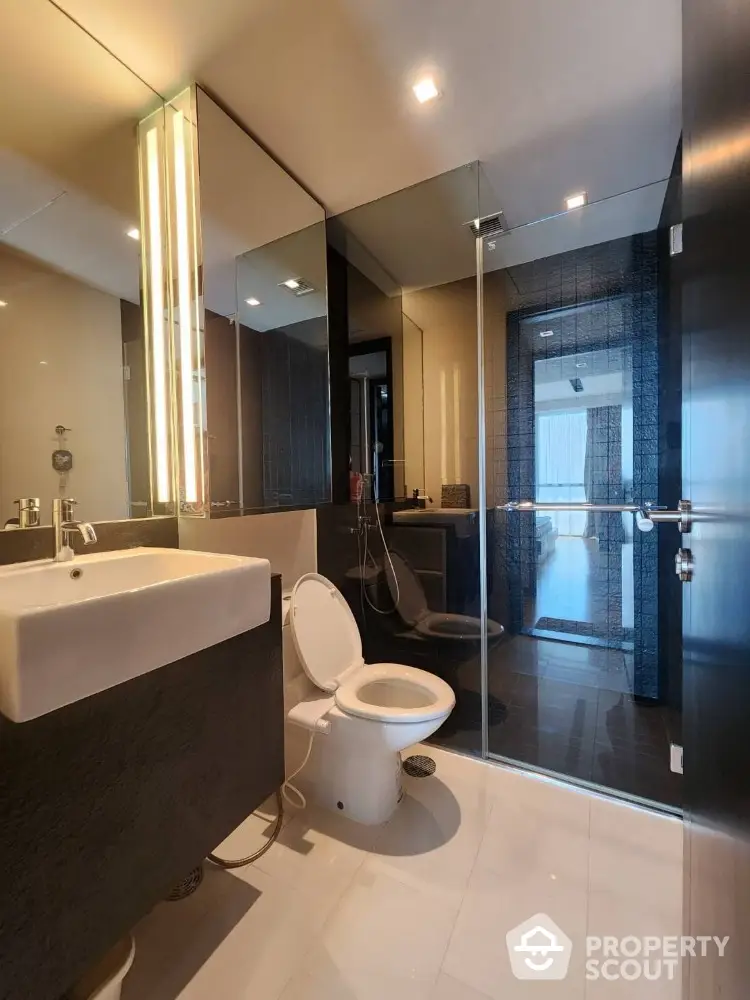 Modern bathroom with glass shower and sleek fixtures