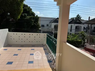 Spacious balcony with tiled flooring and scenic neighborhood view