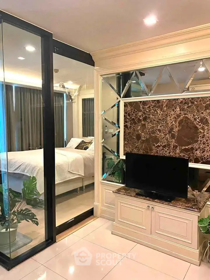 Luxurious bedroom with glass partition and elegant decor
