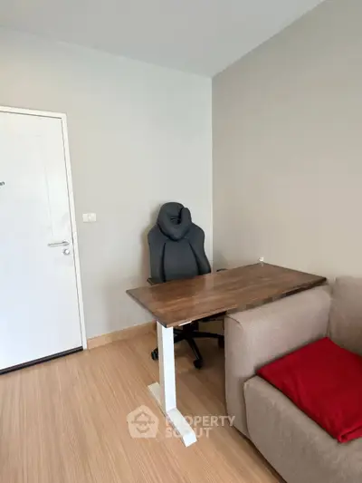 Modern study room with ergonomic chair and wooden desk in cozy apartment