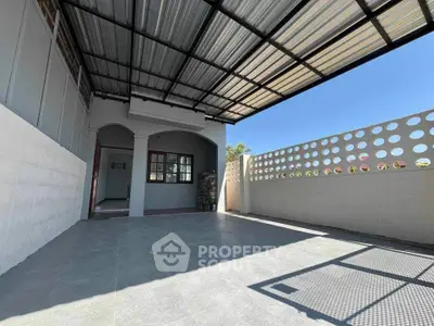 Spacious covered patio with modern design and ample natural light