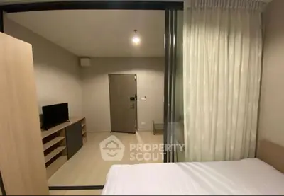 Modern bedroom with sliding glass doors and minimalist decor