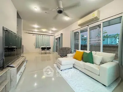 Spacious modern living room with sleek design and natural light