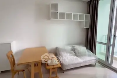 Modern living room with minimalist furniture and balcony access