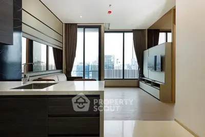 Luxurious modern living room with open kitchen and stunning city view