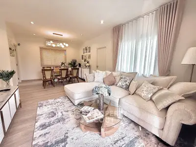 Elegant living room with stylish decor and cozy seating area, perfect for relaxation and entertaining.