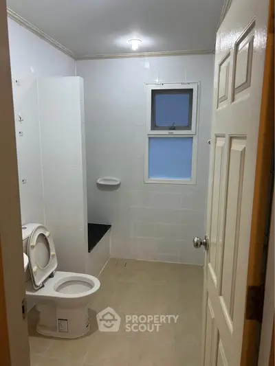 Spacious bathroom with modern fixtures and natural light