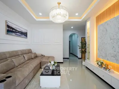 Luxurious living room with elegant chandelier and modern decor