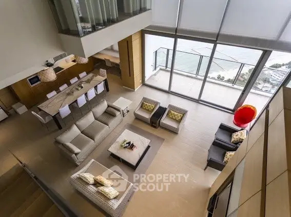 Luxurious modern living room with ocean view and spacious balcony