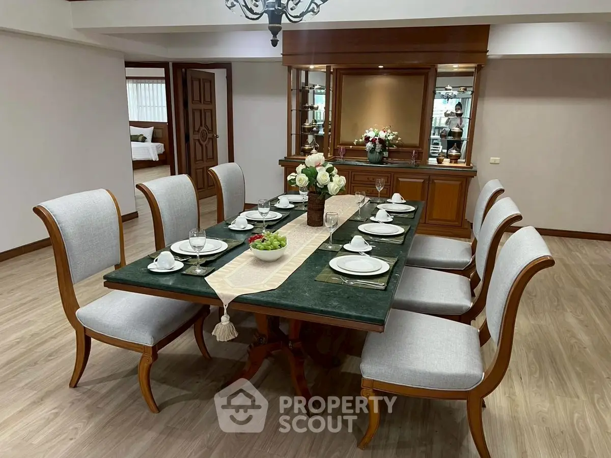 Elegant dining room with classic wooden table and chairs, perfect for family gatherings.