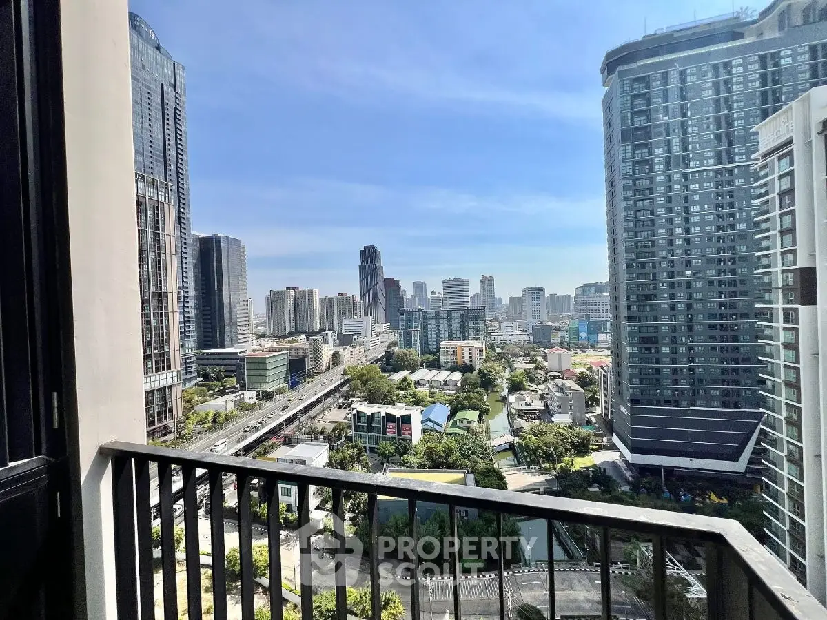 Stunning cityscape view from a high-rise balcony in a modern urban setting.
