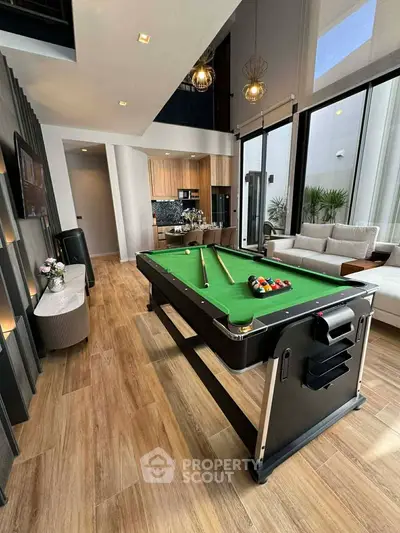 Luxurious living room with pool table and modern decor