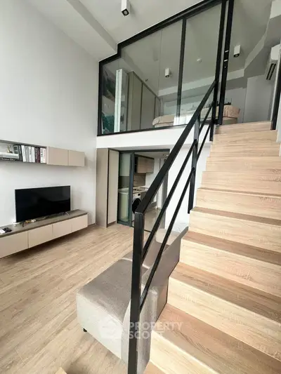 Modern loft apartment with stylish staircase and open living area