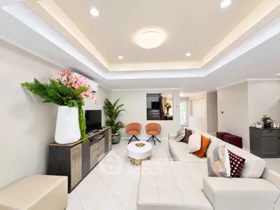 Spacious modern living room with elegant decor and ample natural light