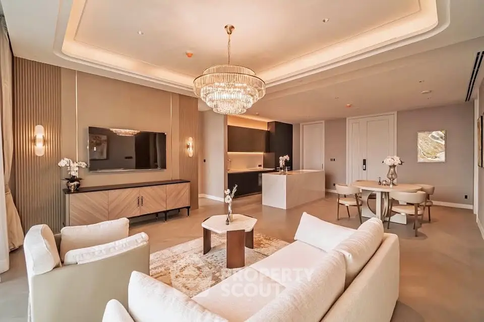 Luxurious open-plan living room with elegant chandelier and modern furnishings