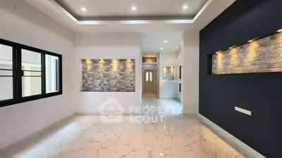 Elegant modern living room with marble flooring and accent lighting