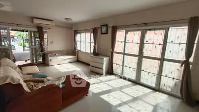 Spacious living room with large windows and natural light