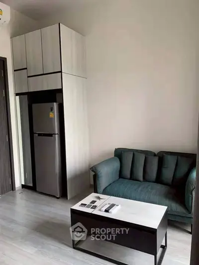 Modern living room with sleek furniture and built-in storage, perfect for urban living.