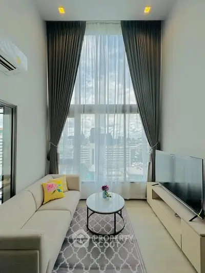 Modern living room with high ceiling and city view through large windows