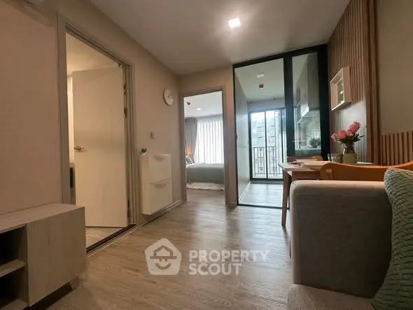 Modern apartment interior with open layout and balcony view