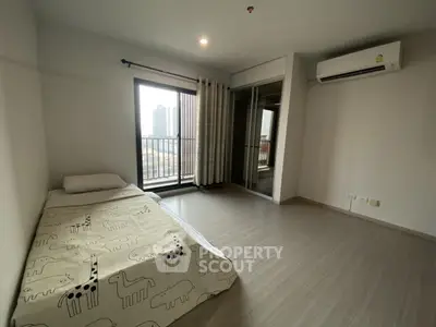Spacious bedroom with city view and modern air conditioning