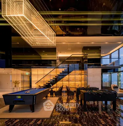 Luxurious modern living room with pool table and stunning lighting in high-rise building.