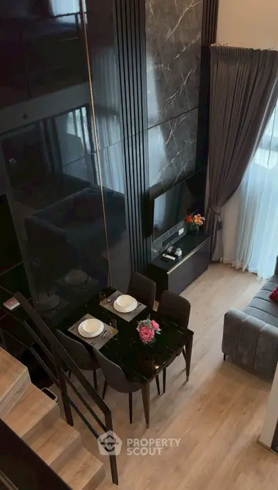 Modern duplex living room with elegant dining area and stylish decor